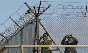 Mideast Lebanon Plane Crash Members of an investigation team from Ethiopia take pictures of the sea through the fence of the airport in Beirut, Lebanon, Tuesday, Jan. 26, 2010. The pilot flew in the opposite direction from the path recommended by the control tower after taking off from Beirut in thunderstorms, Lebanon's transportation minister said Tuesday.