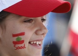 Mideast Lebanon Hariri A Lebanese girl who painted her face with a national flag and the first name of the Lebanese Prime Minister Saad Hariri during the rally