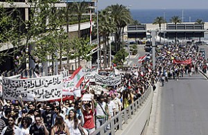 anti sectarianism rally 5 Lebanese take part in a rally calling for Secularism in downtown Beirut on April 25, 2010. Thousands of Lebanese marched to parliament in Beirut in a peaceful rally demanding the secularisation of a state long built on sectarianism