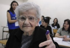 Mideast Lebanon Elections An elderly Lebanese woman shows her inked thumb after casting her ballot during the municipal elections in Amchit on the coast north of Beirut, Lebanon, Sunday, May 2, 2010.