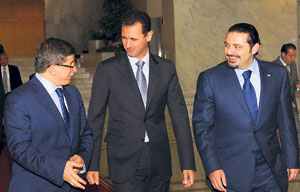 hariri in damascus w assad( C) Davutoğlu( L)