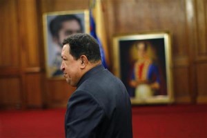 Venezuelan President Hugo Chavez leaves a news conference after winning elections in Caracas