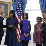 U.S. President Obama takes the oath of office from U.S. Supreme Court Chief Roberts as first lady Michelle holds the bible and daughters Malia and Sasha look on in the Blue Room of the White House in Washington